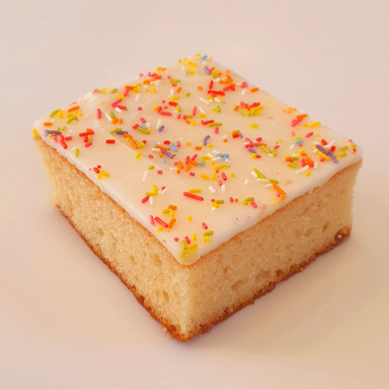 Hunts Bakery Simple old school vanilla sponge cake with white and sprinkles
